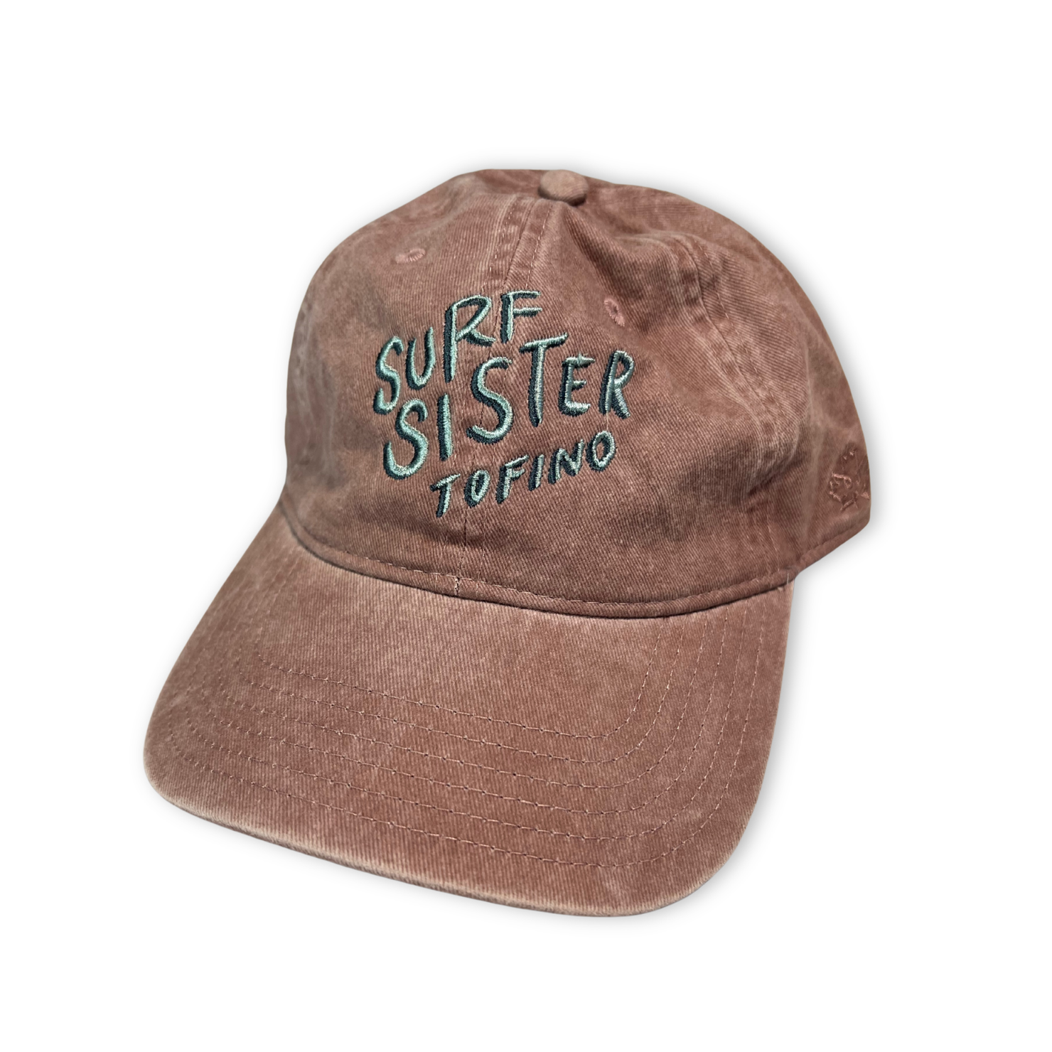 Pink cap with 'Surf Sister Tofino' text on a white background