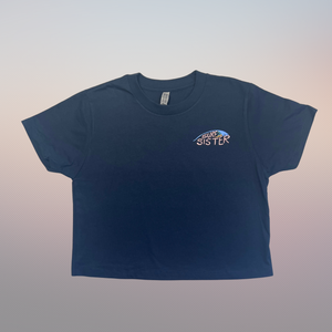 Navy blue t-shirt with 'Surf Sister' logo on a gradient background