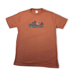 Pink t-shirt with 'Surf Sister' graphic on a white background